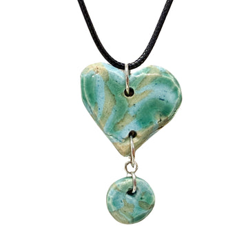 Untitled (green and blue heart necklace) by Trisha Cozine